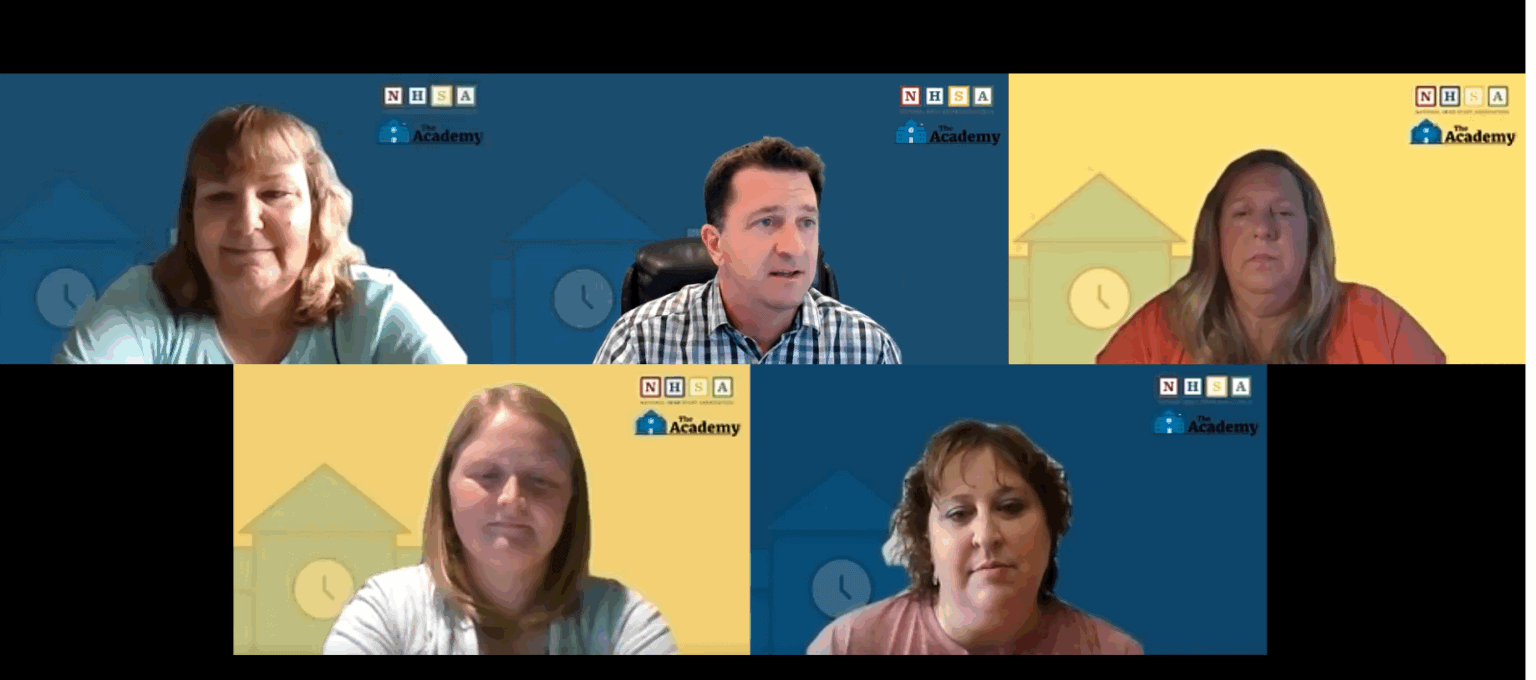 A group of people meeting over zoom. Each person's head appears in its own box.